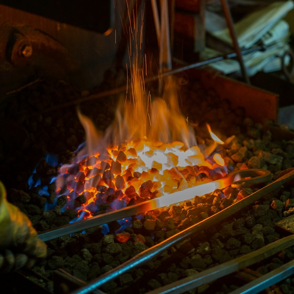 Iron bars heating in the forge fire