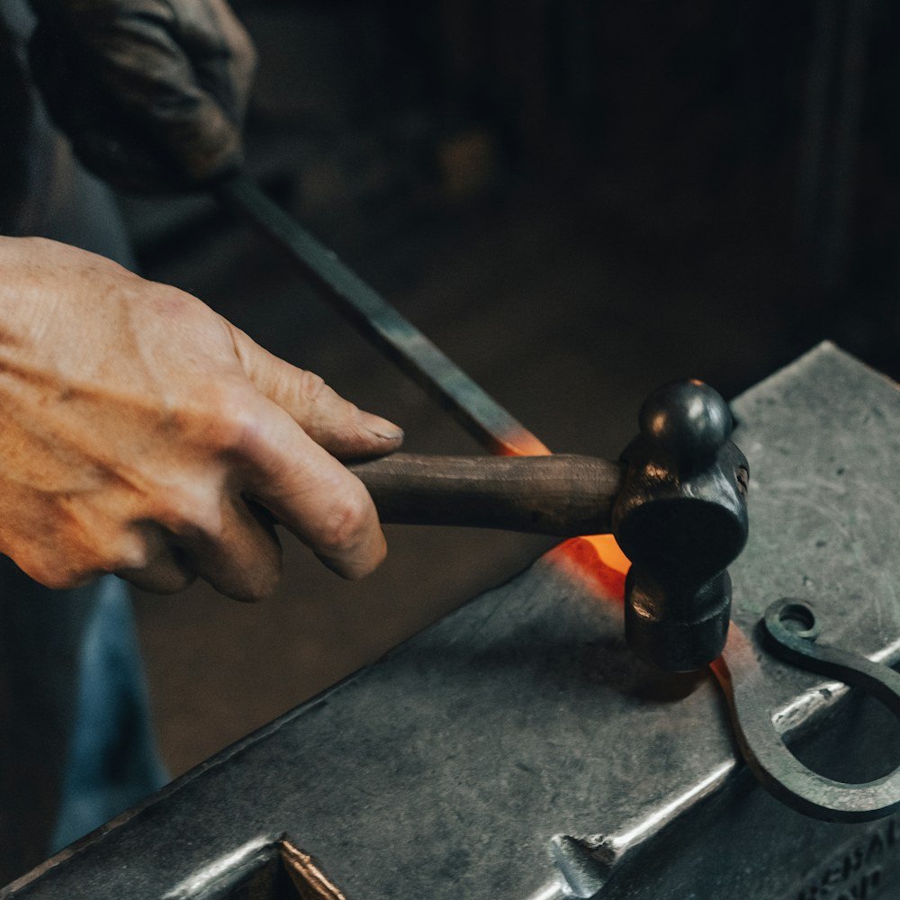 Hand-forged iron scroll on the anvil